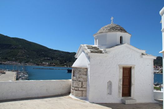 Photo shows Greek old village houses and their surroundings.