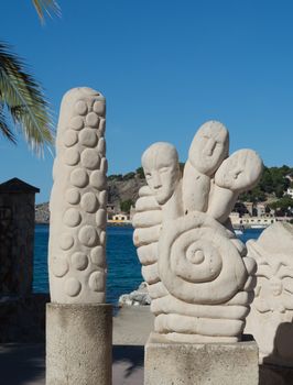 Sculptures on the sea promenade by Playa de Repic beach in Puerto Soller, Mallorca, Balearic islands, Spain.