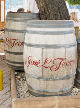 Wine barrels standing outdoors in Puerto Soller, Mallorca, Balearic islands, Spain.