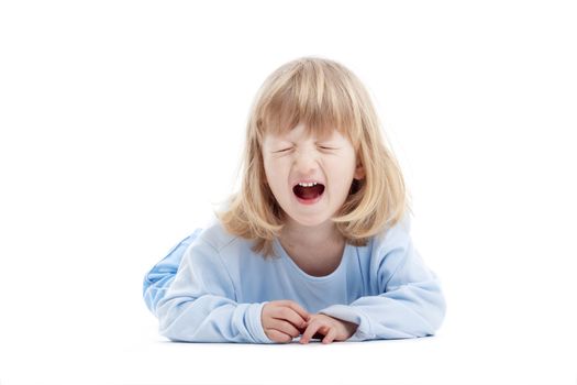 boy with long blond hair on the floor, screaming - isolated on white