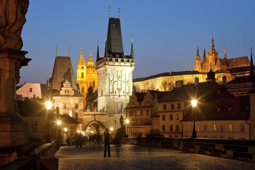 czech republic prague - charles bridge and st. nicolaus church at dusk