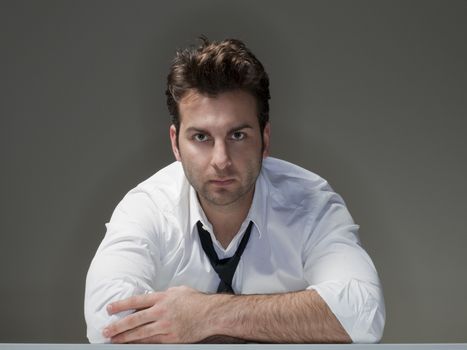 businessman in white shirt looking at camera - isolated on gray