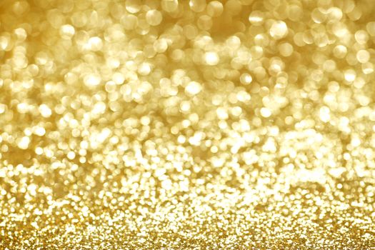 Abstract shining glitters gold holiday bokeh background