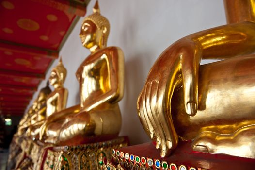 Golden Buddha statues in a Buddhist temple