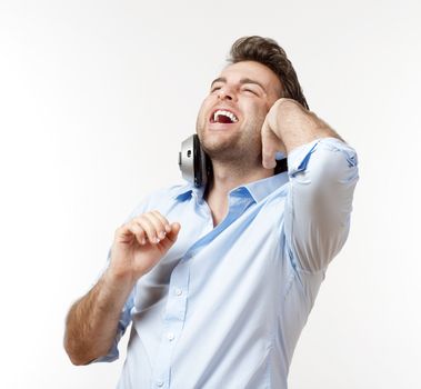 man in blue shirt with earphones listening to music - isolated on white