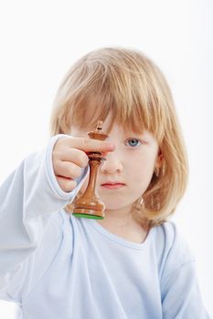 boy with long blond hair holding out a chess piece - isolated on white