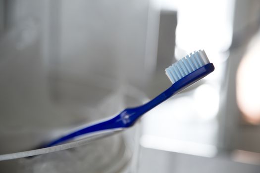 Toothbrush on a bathroom shelf