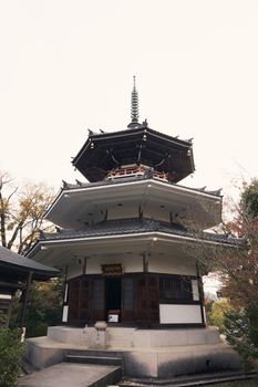 Myoho Temple with octagonal building and triple tower.