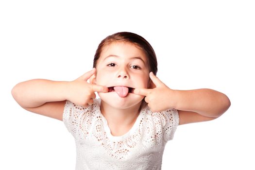 Cute girl making silly funny face, isolated.