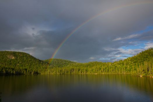 rainbow over the lake, Northern Ontario, Canada