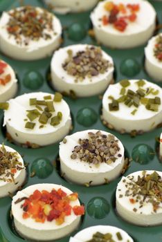 Cheese appetizers decorated with spices