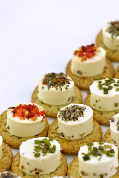 Close-up of cheese appetizers decorated with spices and vegetable