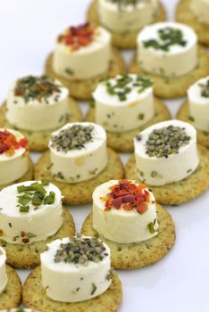 Close-up of cheese appetizers decorated with spices and vegetable