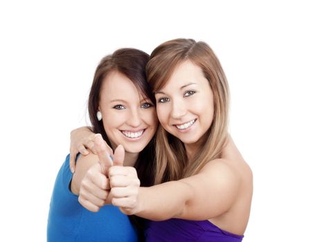 two young women showing thumbs up, smiling - isolated on white