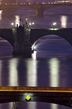 prague - bridges over vltava river at dusk - charles bridge in focus