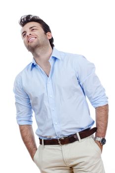 man in blue shirt and light trousers standing, smiling- isolated on white