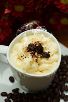 Espresso con panna coffee and Red chrysanthemum flower