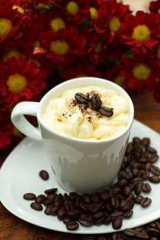 Espresso con panna coffee and Red chrysanthemum flower