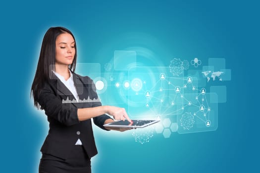 Beautiful businesswomen in suit using digital tablet. Glow circles, transparent rectangles, graphs and network