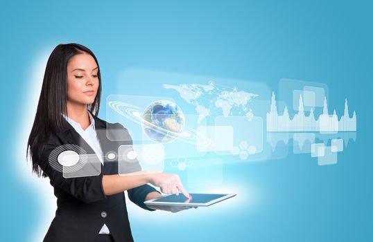 Beautiful businesswomen in suit using digital tablet. Earth with graphs and world map. Element of this image furnished by NASA