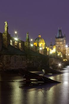 czech republic prague - charles bridge and spires of the old town at dusk