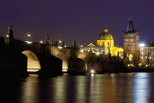 czech republic prague - charles bridge and spires of the old town at dusk