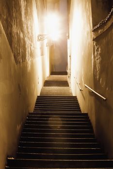 prague - narrow stairway illuminated with gas lanterns at mala strana