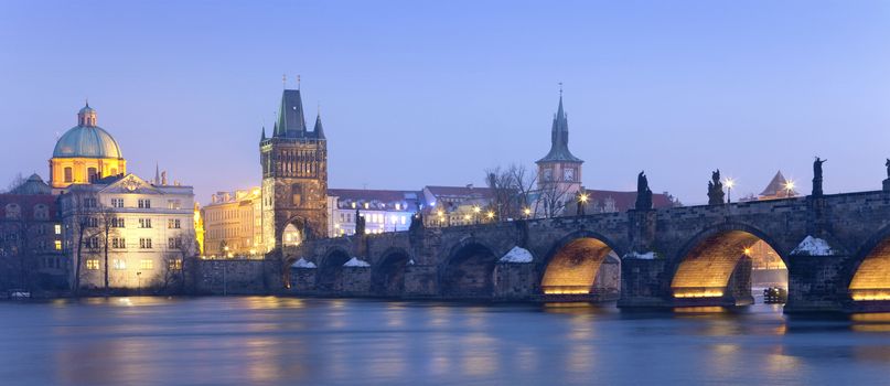 czech republic prague - charles bridge and spires of the old town at dusk