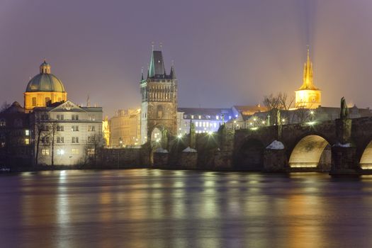 czech republic prague - charles bridge and spires of the old town at dusk