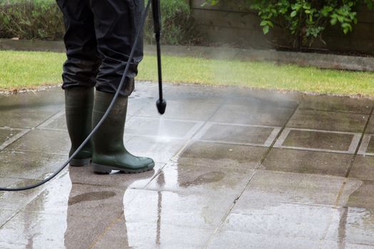 Outdoor floor cleaning with high pressure water jet