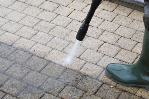 Outdoor floor cleaning with high pressure water jet