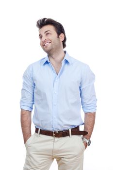 man in blue shirt and light trousers standing, smiling- isolated on white