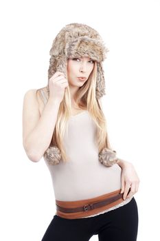 beautiful blond girl with blue eyes in fur hat - isolated on white
