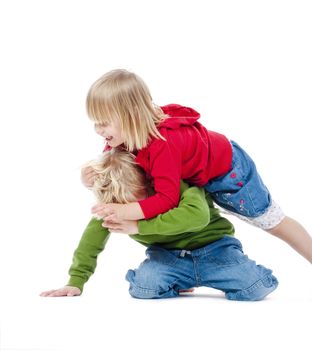 two young siblings fooling around with each other - isolated on white