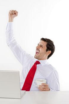 young business executive in white shirt and red tie cheering - isolated on white