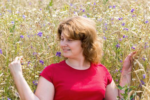 portrait of middle aged woman  one the meadow