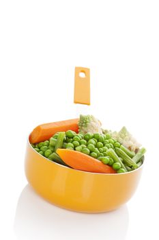 Steamed vegetable in orange pan isolated on white background. Carrot, green beans, green peas and romanesco broccoli. Healthy eating and healthy living. 