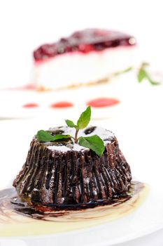 Chocolate dessert fondant with peppermint leaves and icing on top