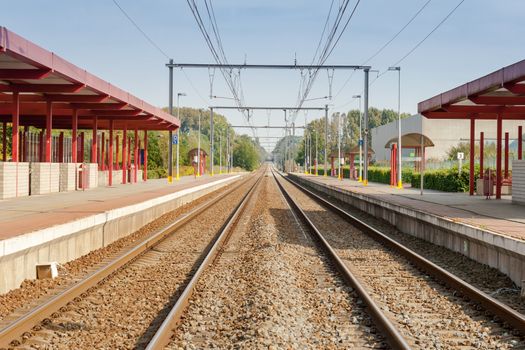 railway station with two tracks and electric power