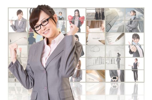 Cheerful Asian business woman standing in front of TV screen wall, closeup portrait.