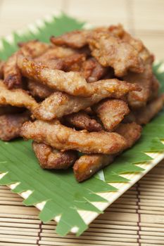 Breaded pork dish Placed on a wooden table.