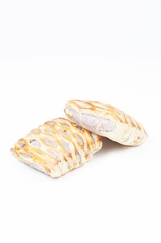 bread on white isolated background.Bread baked with a sweet fruit filling inside.