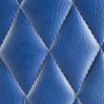 Blue leather seat. A background made ������of leather seat material.