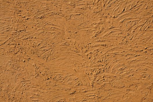 The texture of light-brown walls painted large erratic strokes of pain                              
