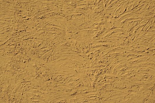 The texture of walls painted large erratic strokes of pain tinted sepia                    