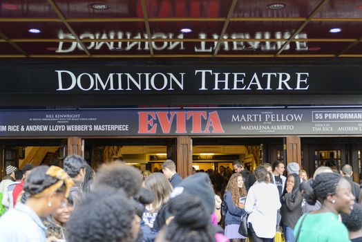 LONDON, UK - OCTOBER 05: Visitors at the entrance to the musical Evita, in the Dominon Theatre, The musical replaces We Will Rock You, which ran for 12 years. October 05, 2014 in London.
