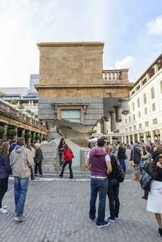 LONDON, UK - OCTOBER 05: Tourist observing artwork by artist Alex Chinneck in Covent Garden. The floating piazza will remain there until the end of the month. October 05, 2014 in London.