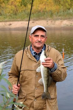 old fisherman and his catch - zander