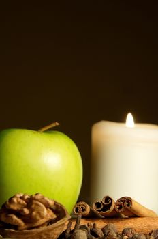 Green apple, cinnamon, walnut and a candle