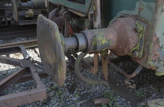 iron old rusted train buffer with railroad track